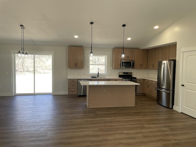 2412 W Garfield, New Era, MI 49446 - kitchen featuring light countertops, decorative backsplash, a sink, and stainless steel appliances
