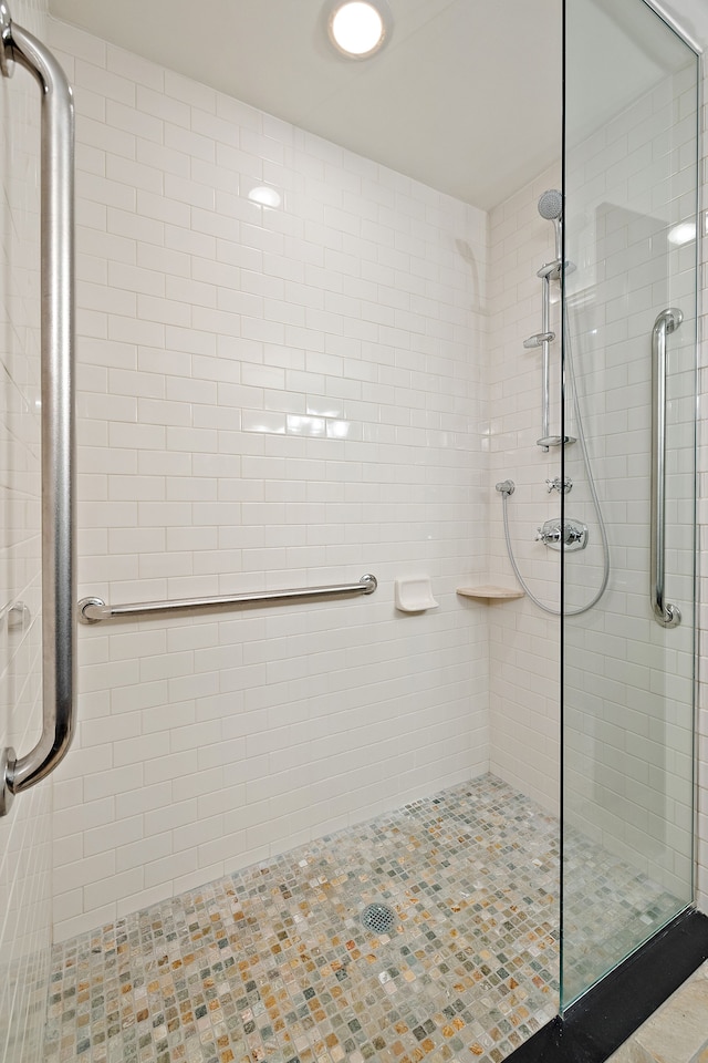 bathroom with a shower stall