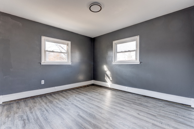 spare room with light hardwood / wood-style floors