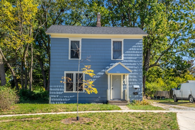 view of front of property with a front lawn