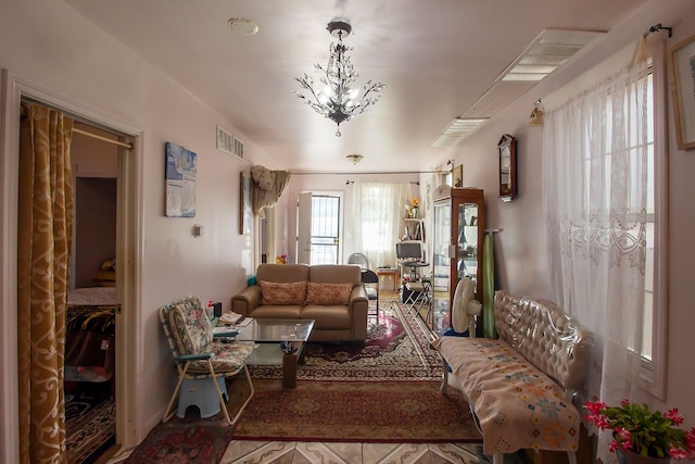 living room with a notable chandelier