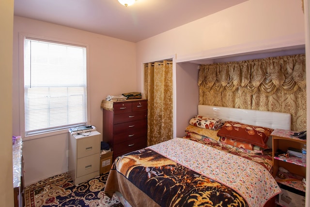 bedroom with multiple windows