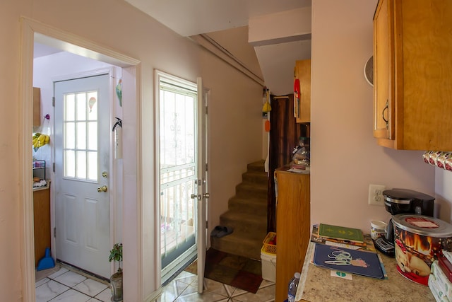 entryway with light tile patterned floors