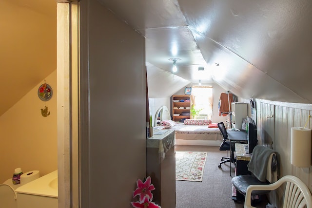 carpeted bedroom featuring vaulted ceiling