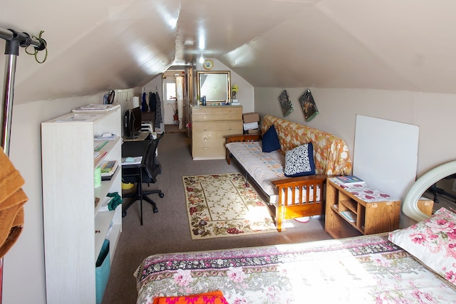 carpeted bedroom with lofted ceiling