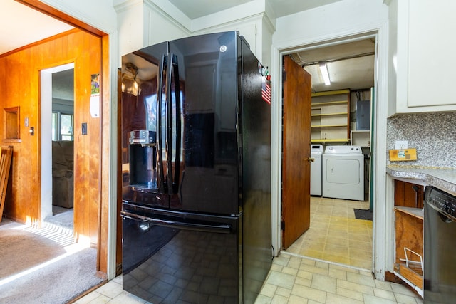 21048 Whitlock St, Farmington Hills, MI 48336 - kitchen with black appliances, washer and clothes dryer, white cabinets, electric panel, and decorative backsplash
