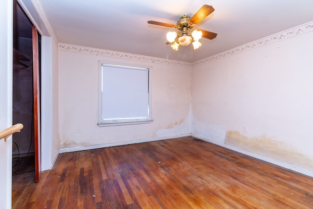 spare room with ceiling fan and dark hardwood / wood-style floors