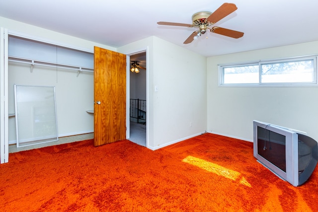 unfurnished bedroom featuring carpet flooring, ceiling fan, and a closet