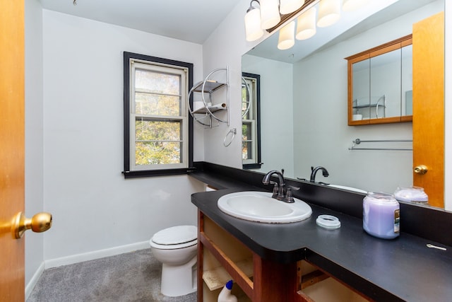 21048 Whitlock St, Farmington Hills, MI 48336 - bathroom featuring toilet, baseboards, and vanity
