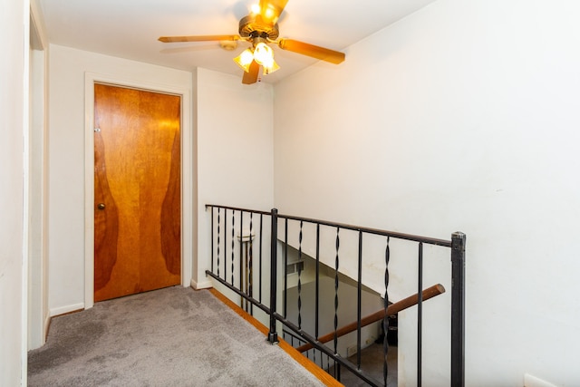 corridor with light colored carpet