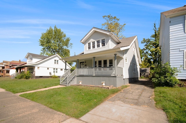 view of front of house with a porch and a front yard