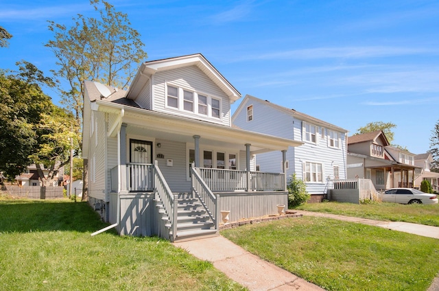 view of front facade with a front yard and a porch