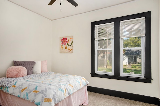 carpeted bedroom with ceiling fan