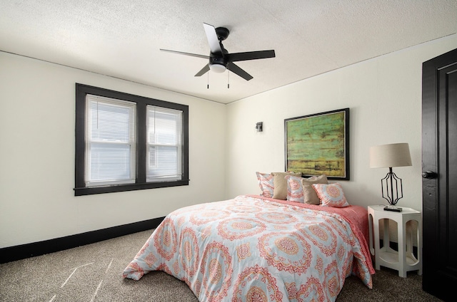 bedroom featuring a textured ceiling, carpet floors, and ceiling fan