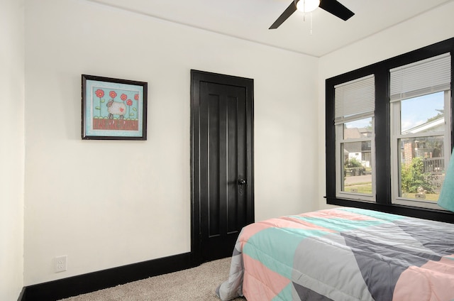 carpeted bedroom with ceiling fan