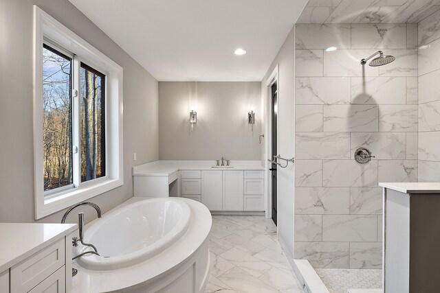2280 Heidi Dr, Oxford, MI 48370 - full bathroom with marble look tile flooring, a garden tub, a tile shower, recessed lighting, and vanity