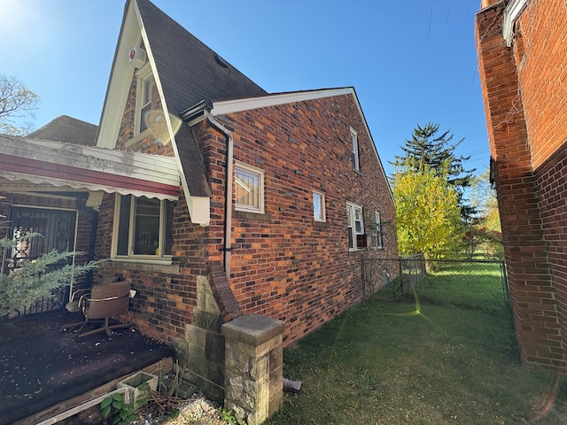 view of home's exterior featuring a lawn