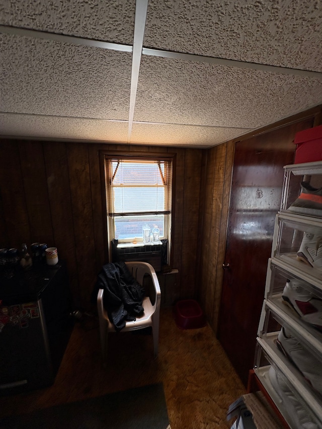 home office with wood walls