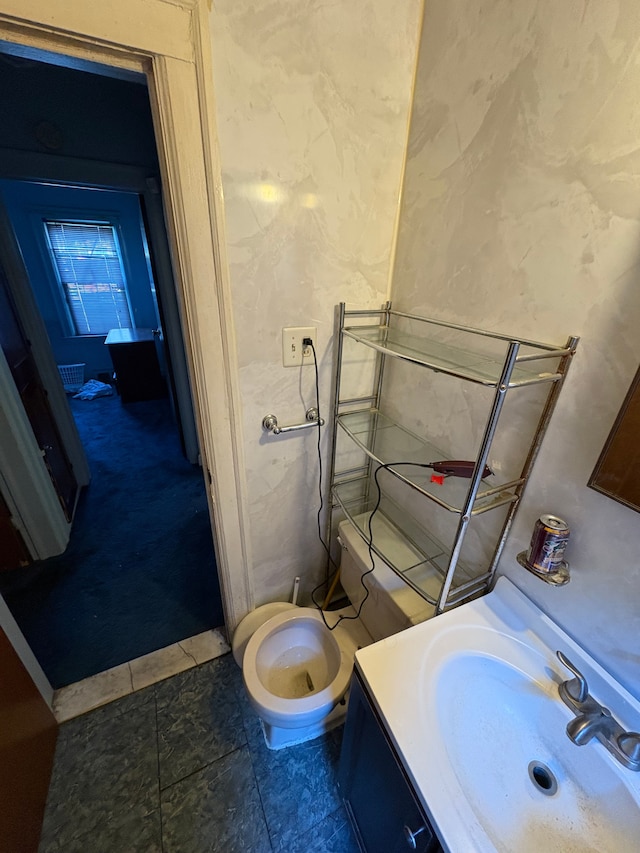 bathroom with tile patterned flooring and vanity