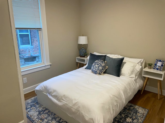 bedroom featuring hardwood / wood-style flooring