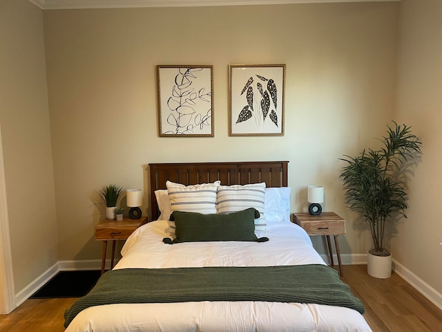 bedroom featuring hardwood / wood-style floors