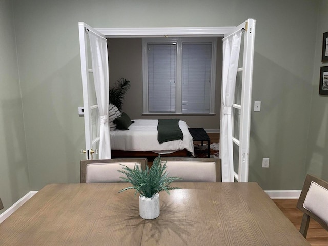 bedroom with wood-type flooring