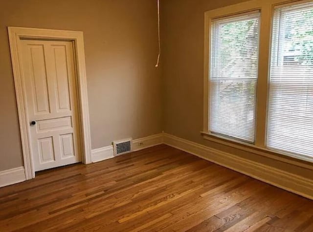 empty room with wood-type flooring