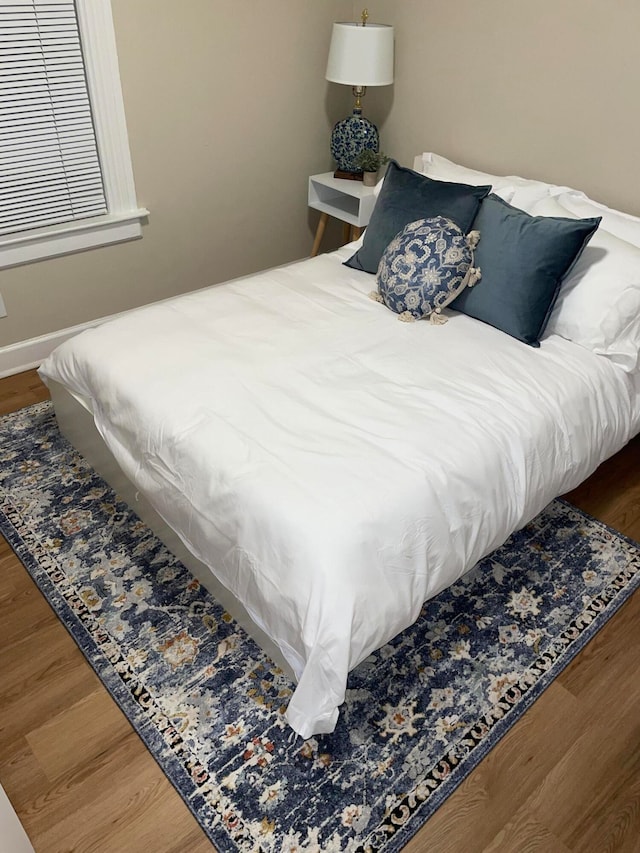 bedroom with wood-type flooring