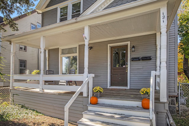 doorway to property featuring covered porch