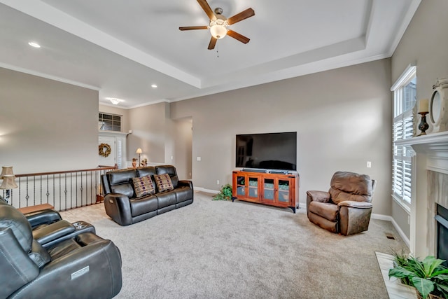 living room with a fireplace, carpet floors, and a healthy amount of sunlight