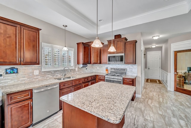 kitchen featuring a center island, backsplash, sink, hanging light fixtures, and stainless steel appliances