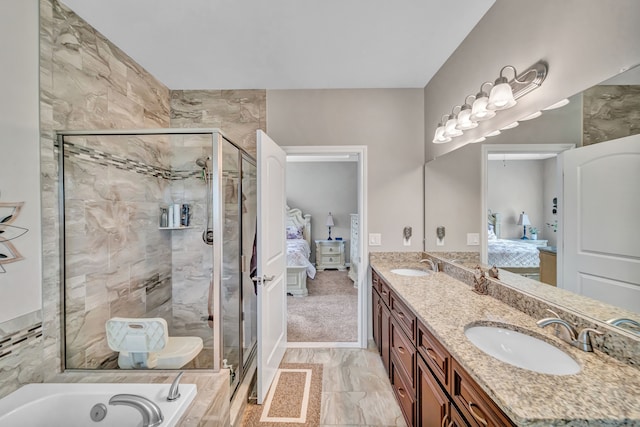 bathroom featuring separate shower and tub and vanity