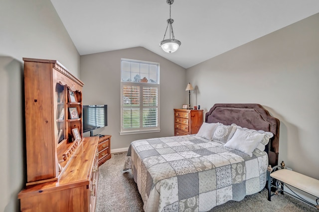 bedroom featuring light carpet and lofted ceiling