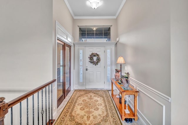 entryway featuring light hardwood / wood-style flooring and ornamental molding