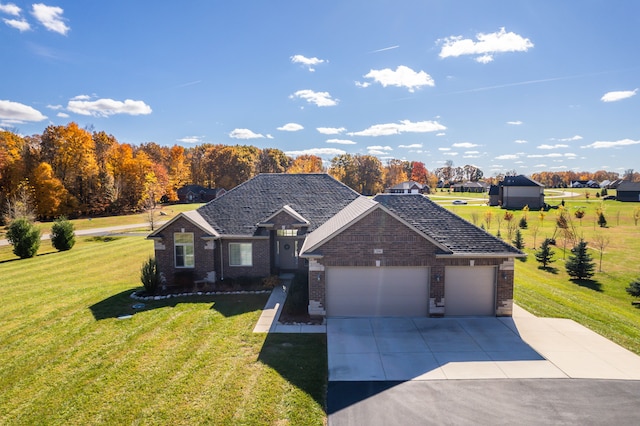 ranch-style home featuring a front yard and a garage