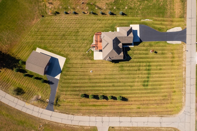 birds eye view of property with a rural view