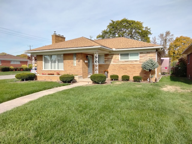 ranch-style home featuring a front yard