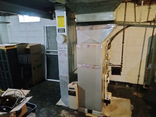 utility room with heating unit