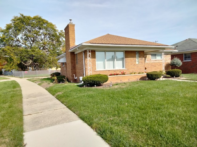 view of side of property featuring a yard