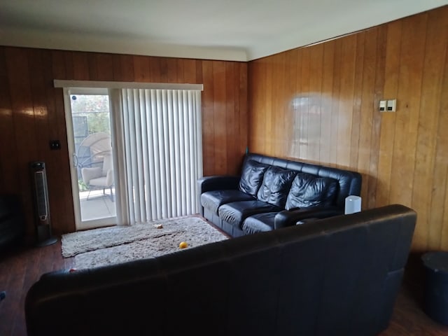 living room featuring wood walls