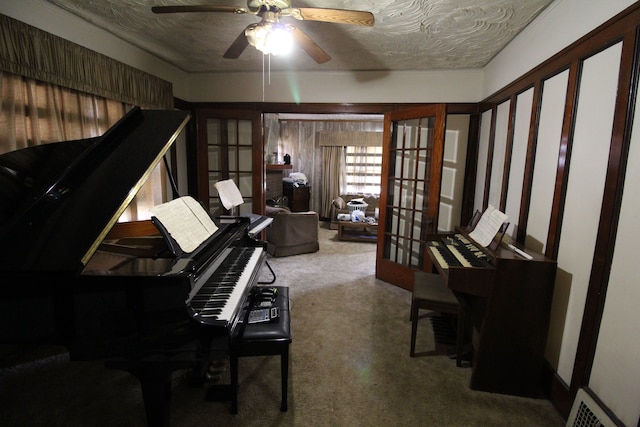 miscellaneous room featuring french doors, carpet, and a textured ceiling