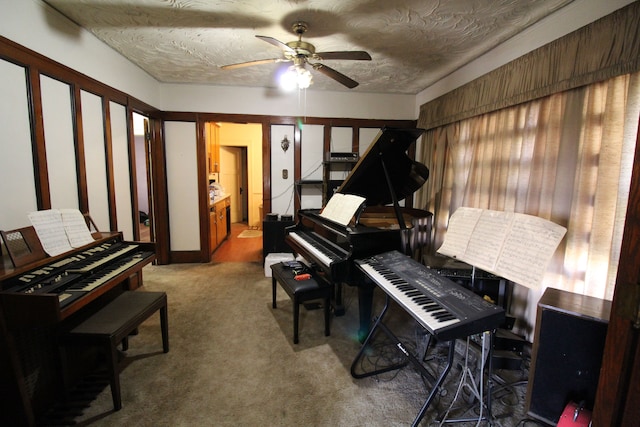 miscellaneous room featuring carpet, a textured ceiling, and ceiling fan