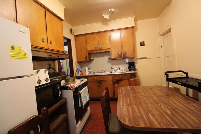 kitchen with sink and white appliances