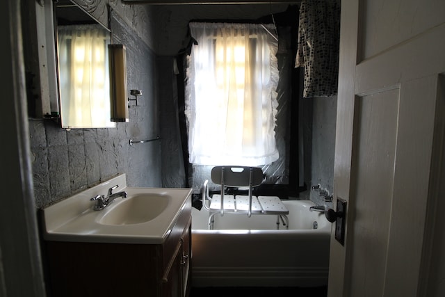 bathroom featuring vanity and a bathing tub