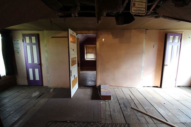 unfurnished room with wood-type flooring