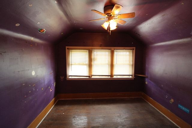 bonus room with ceiling fan, dark hardwood / wood-style flooring, and lofted ceiling