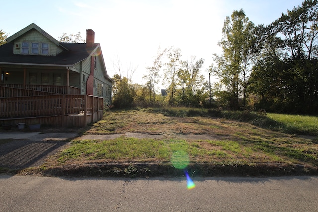 view of yard with a wooden deck