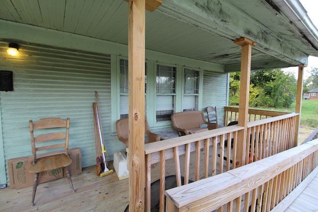 wooden terrace with a porch