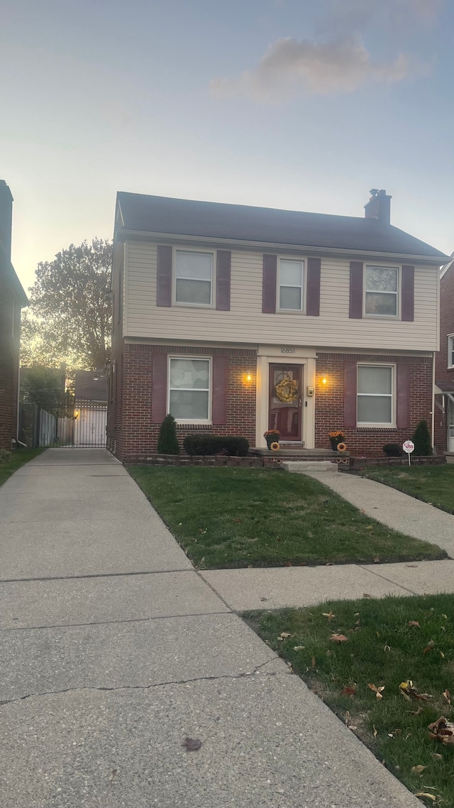 view of front of home with a lawn