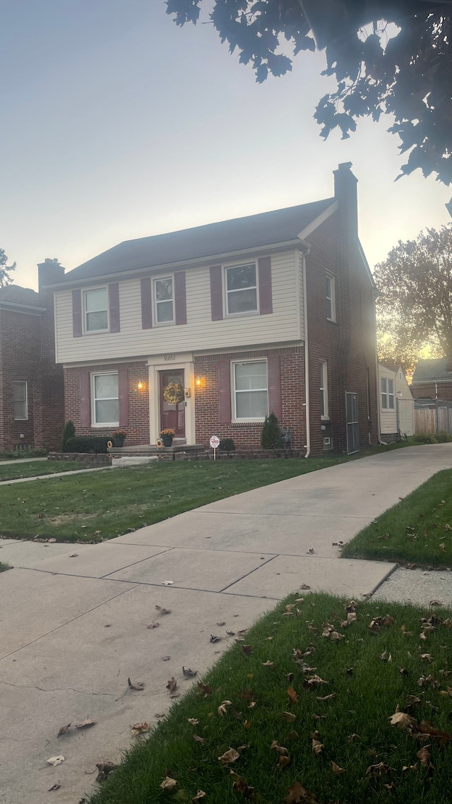 view of front of home with a lawn